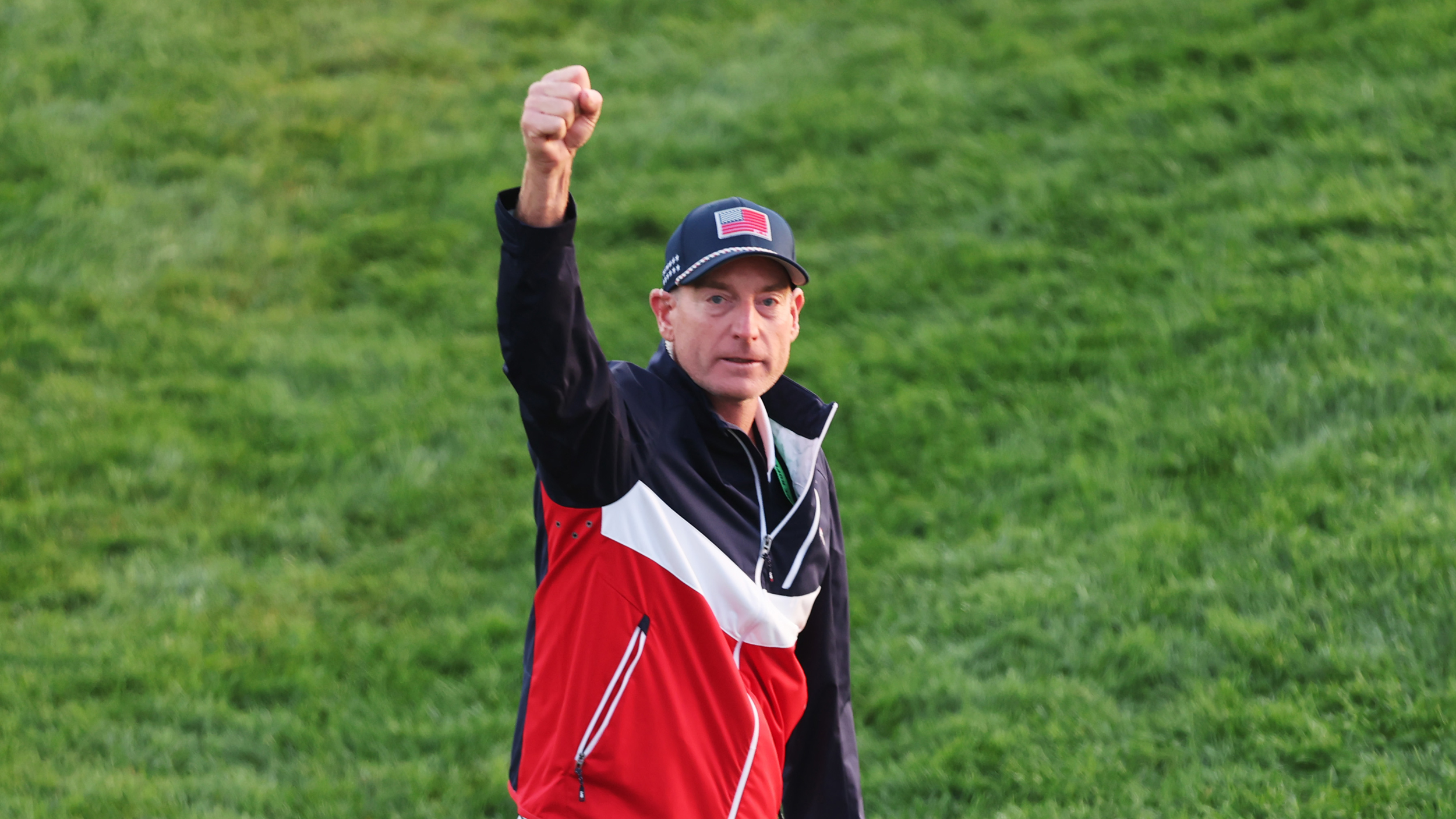 Jim Furyk puts his fist in the air towards the crowd during the 2025 Ryder Cup