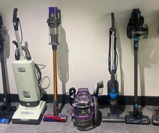 Vacuums lined up against a wall in the test studio.