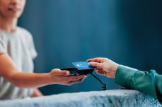 Handing Over a Credit Card for Contactless Payment