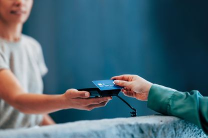 Handing Over a Credit Card for Contactless Payment