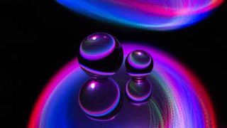 Abstract spheres represent the three-body problem in physics.