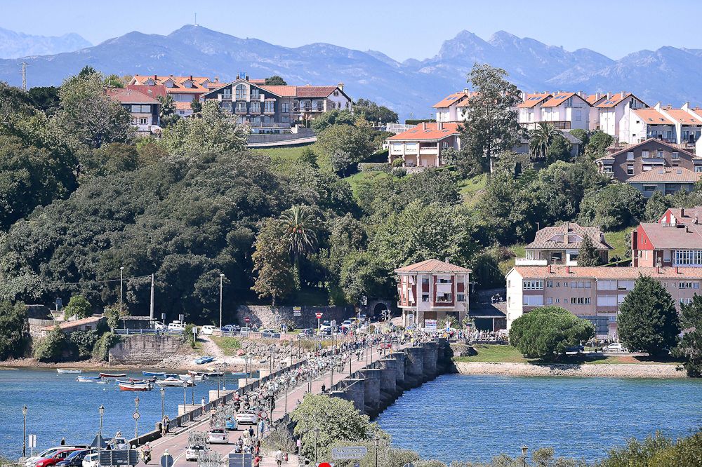 The peloton crosses a bridge during stage 15 of the Vuelta a Espana.