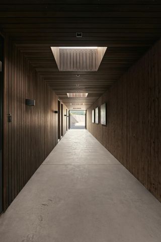 Moody corridor inside the Villa AA by CF Moller