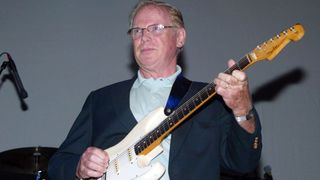 Session guitarist Vic Flick performs with tribute band The Fab Four at the House of Blues club, celebrating the 40th anniversary of the Beatles and to help launch the DVD of "A Hard Day's Night" October 1, 2002 in Beverly Hills, California.