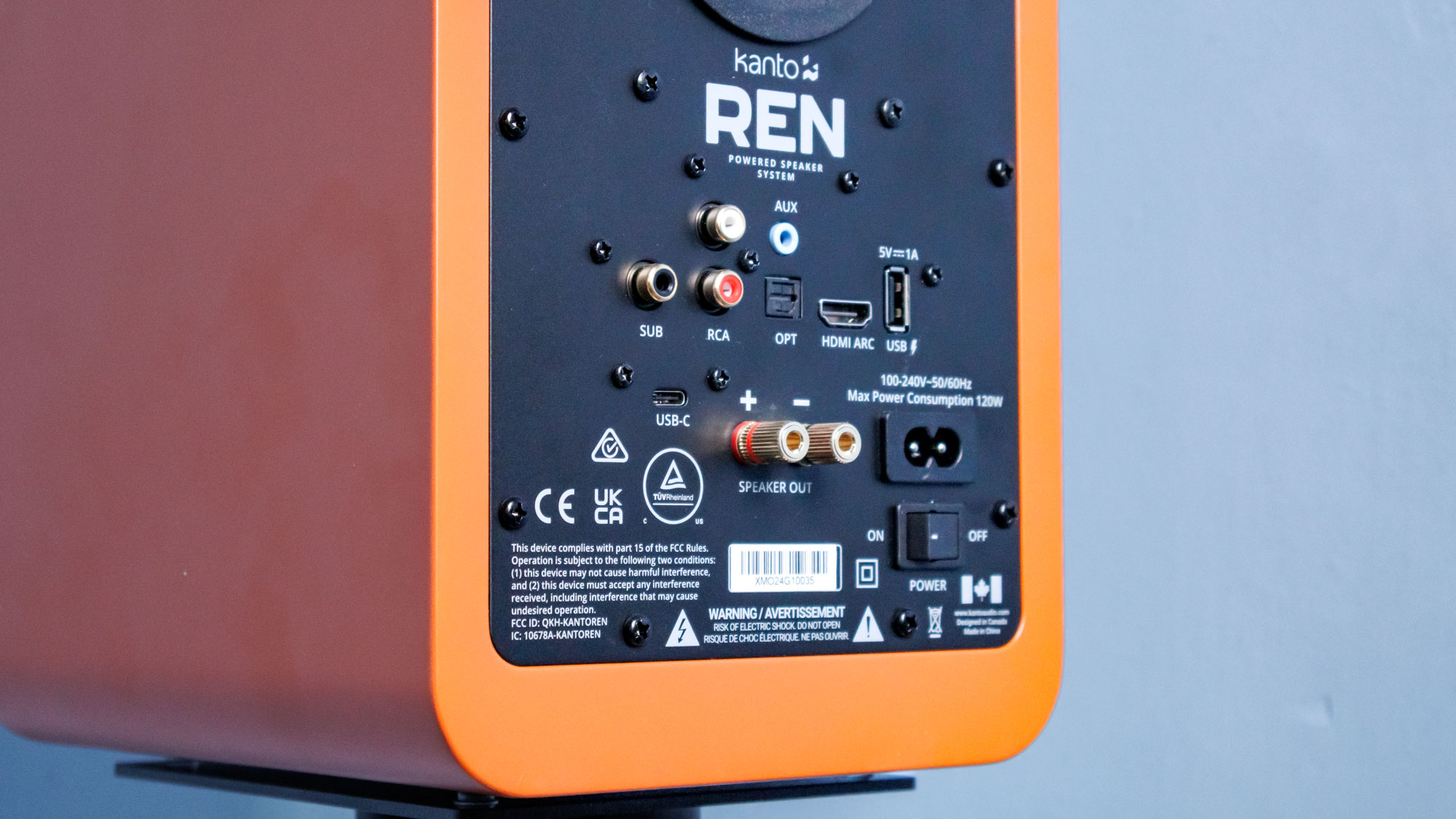 Kanto Ren inputs and outputs in front of a blue wall
