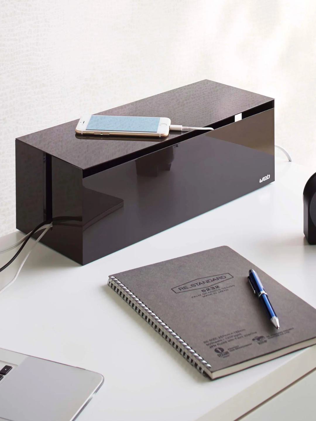 A brown cord organizer box from Yamazaki