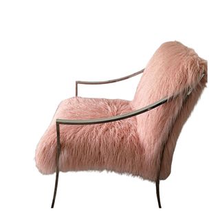 A midcentury modern fuzzy pink chair