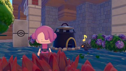 Taking a picture in front of the smelting furnace with Rolycoly in Pokemon Pokopia