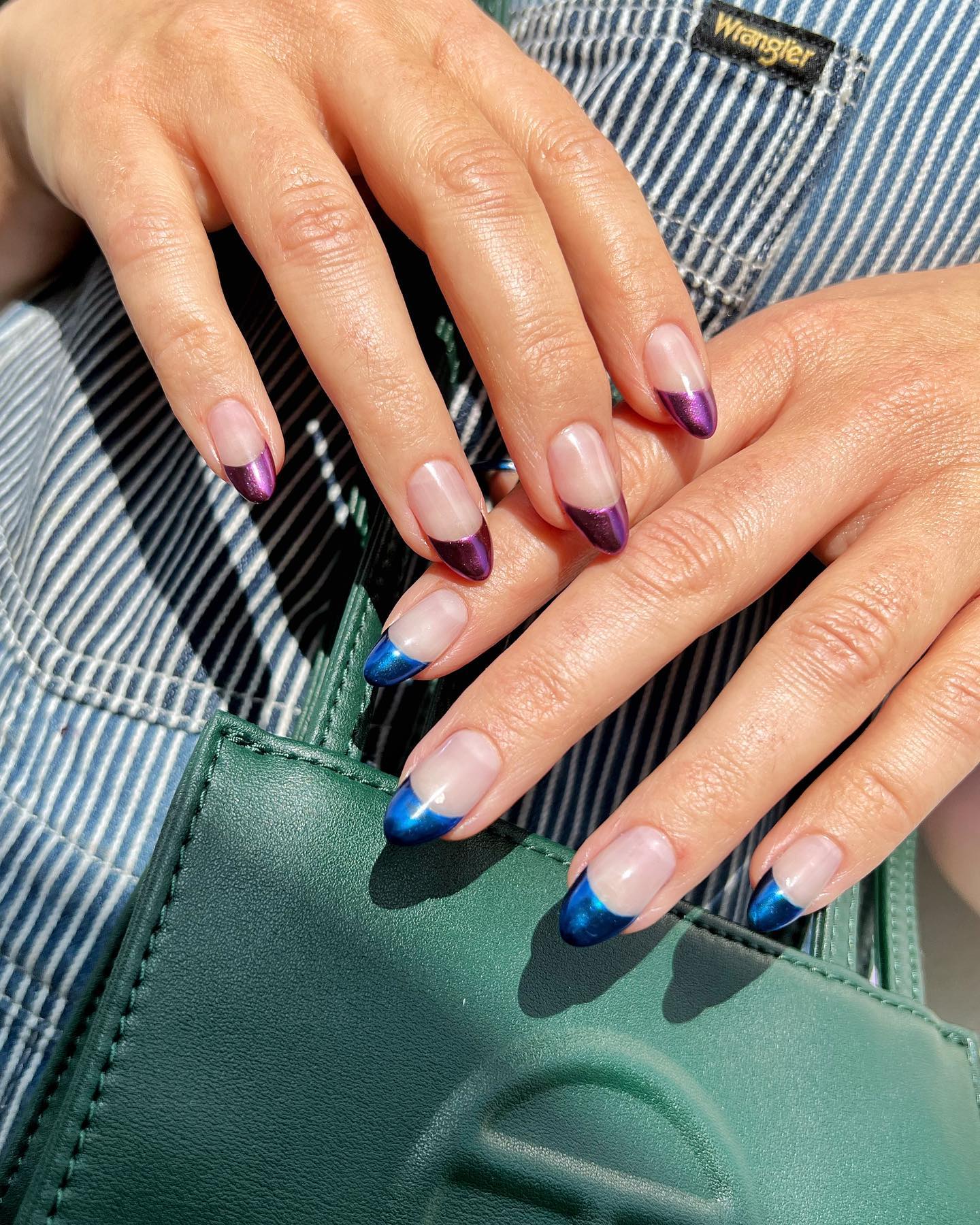 A mismatched chrome French manicure by Queenie Nguyen.
