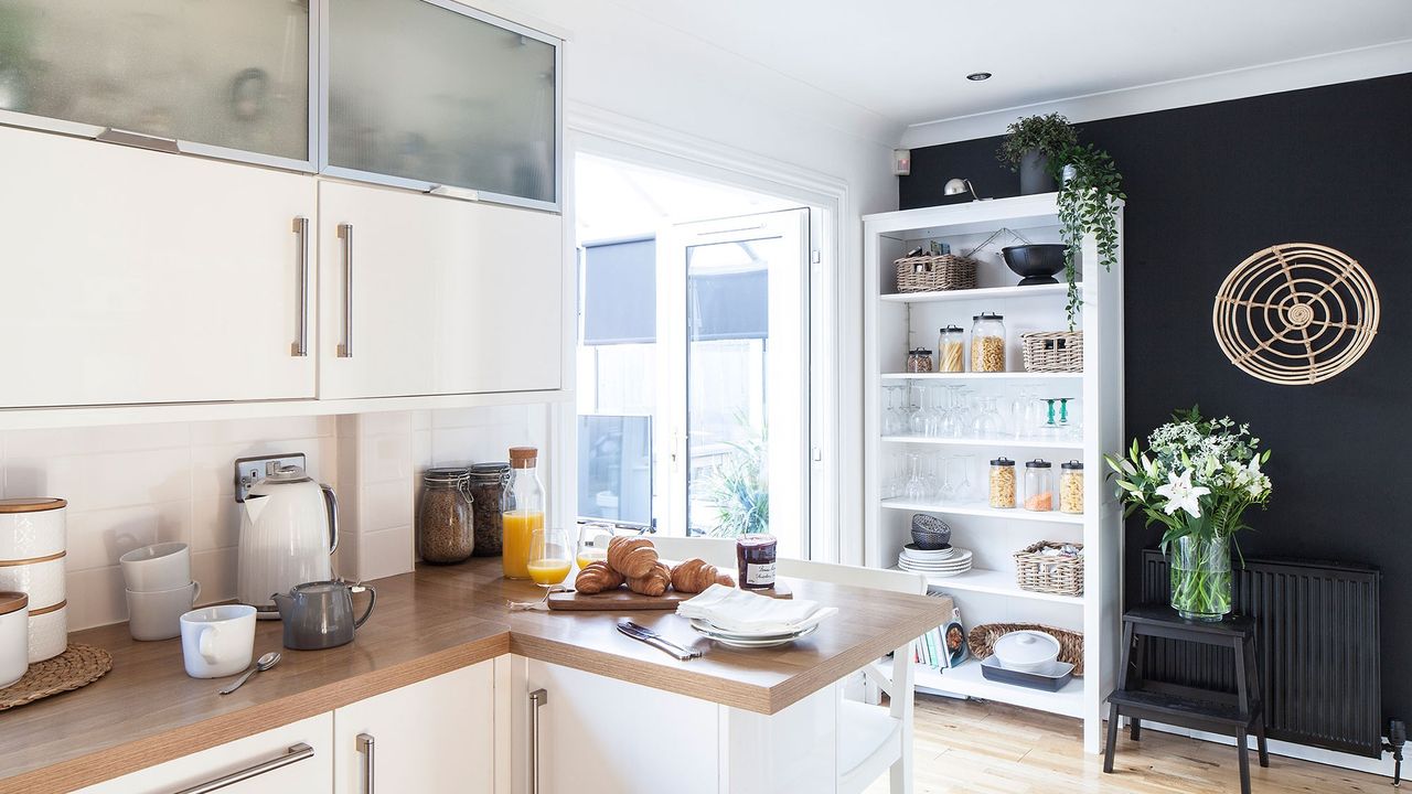 kitchen room having wooden shelves and wooden flooring