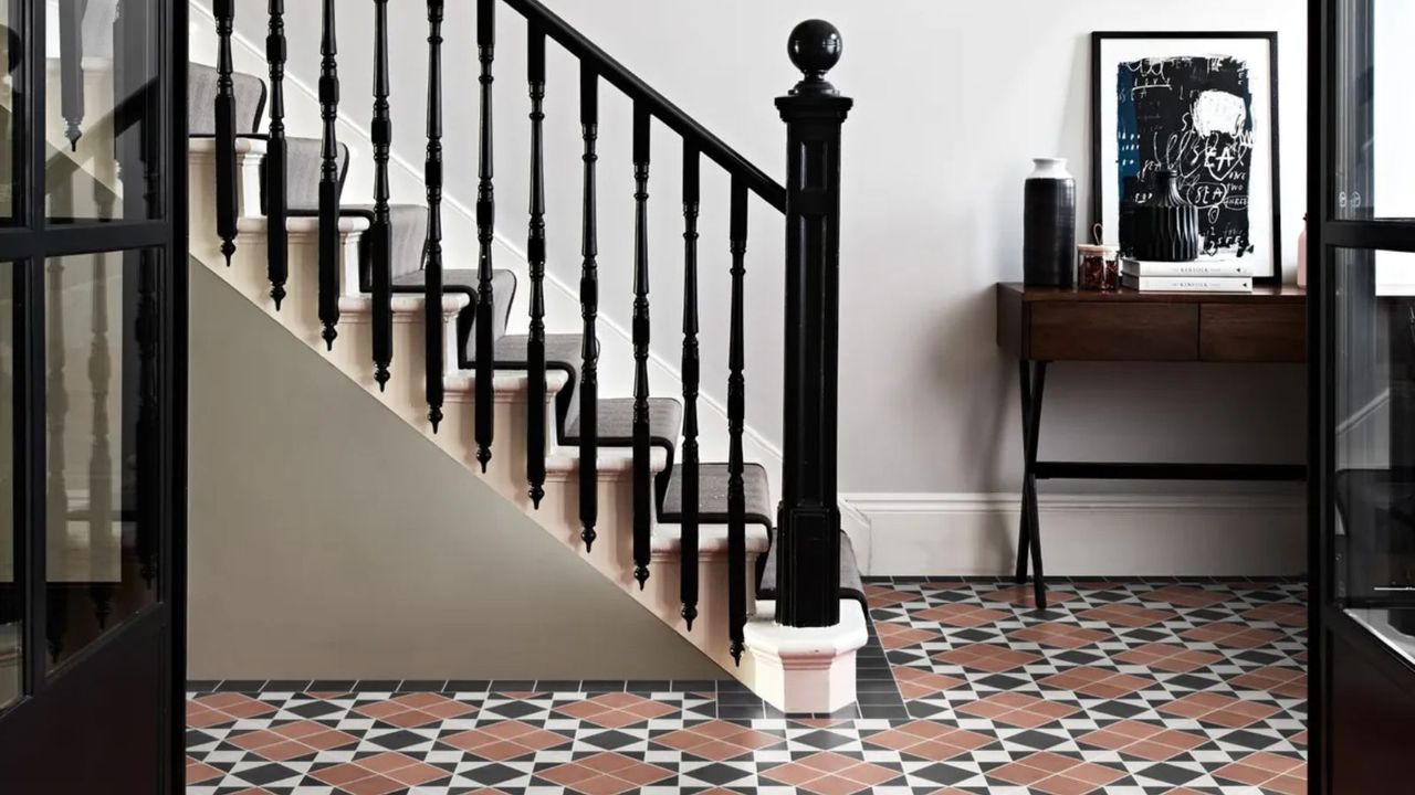 A Victorian hallway with a highly patterned tile floor