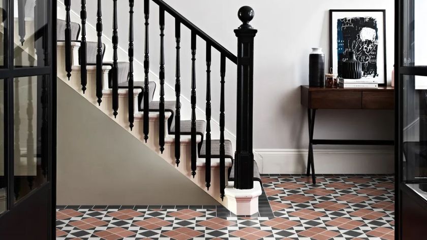 A Victorian hallway with a highly patterned tile floor