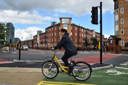 A woman on a Bee Network bike