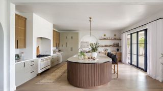 Oval kitchen island, white living room, wooden frame