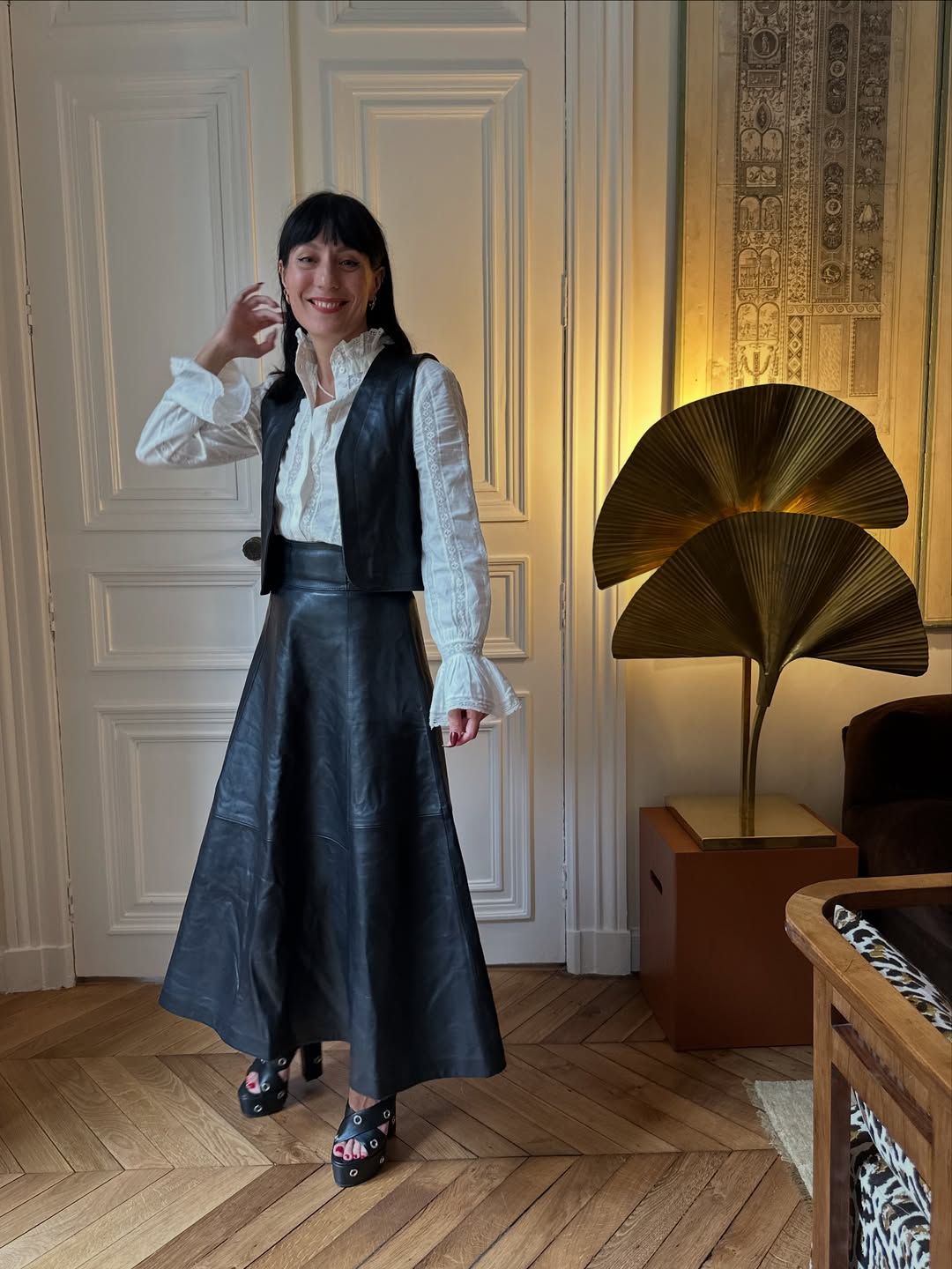 Influencer Katherine Ormerod wearing a leather skirt.