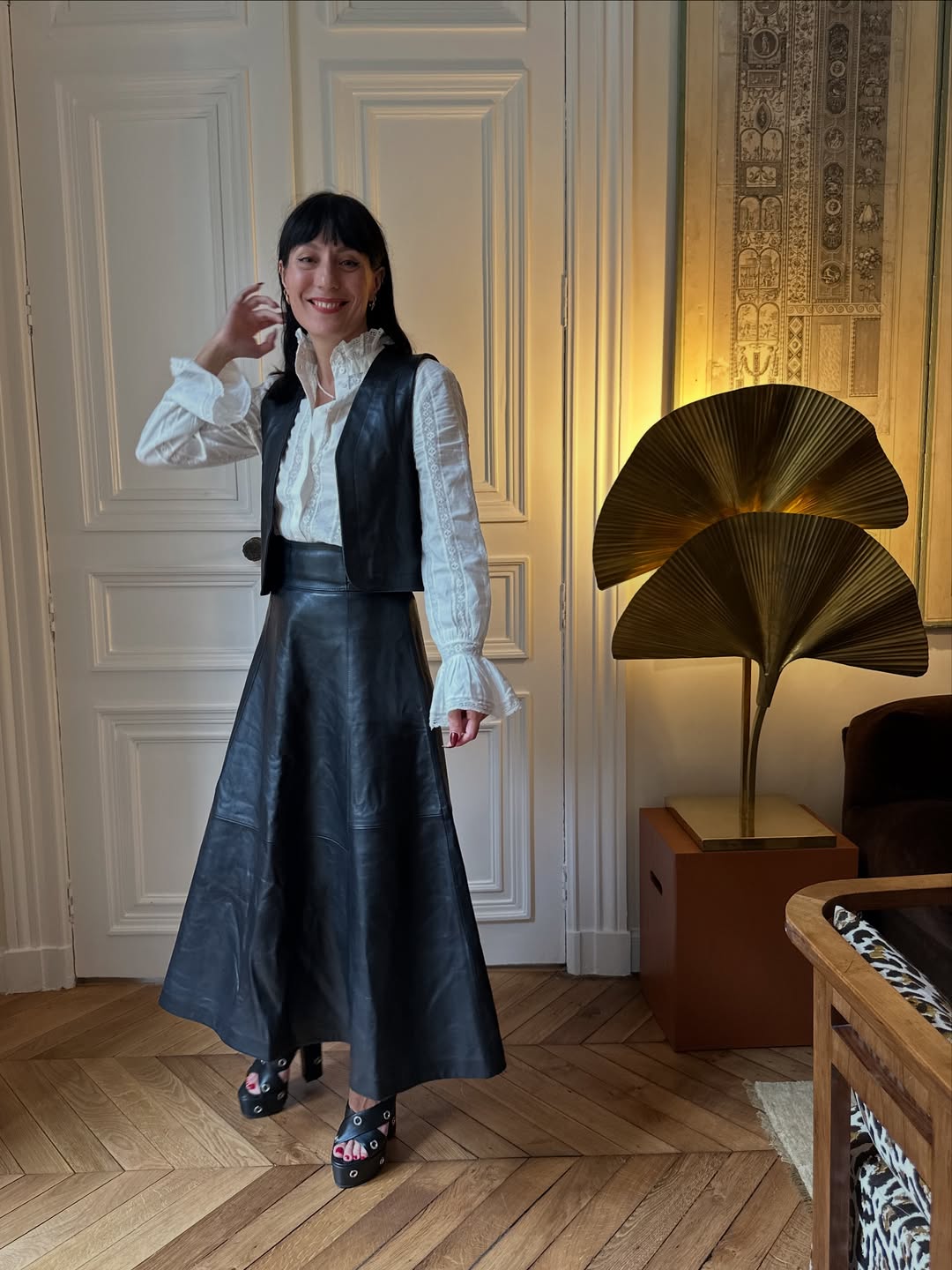 Influencer Katherine Ormerod wearing a leather skirt.