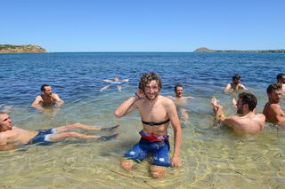 Bahrain-Merida rider Manuele Boaro has a swim in 41 degree Celsius heat with other riders after finishing on the third day of the Tour Down Under