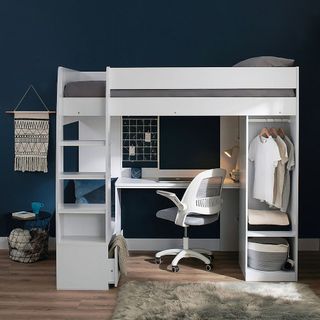 white storage unit in blue room with desk