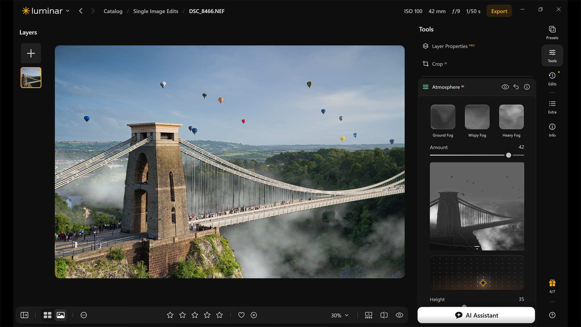 Screenshot from Luminar showing bridge beneath air balloons, using Atmosphere AI tool to create mist