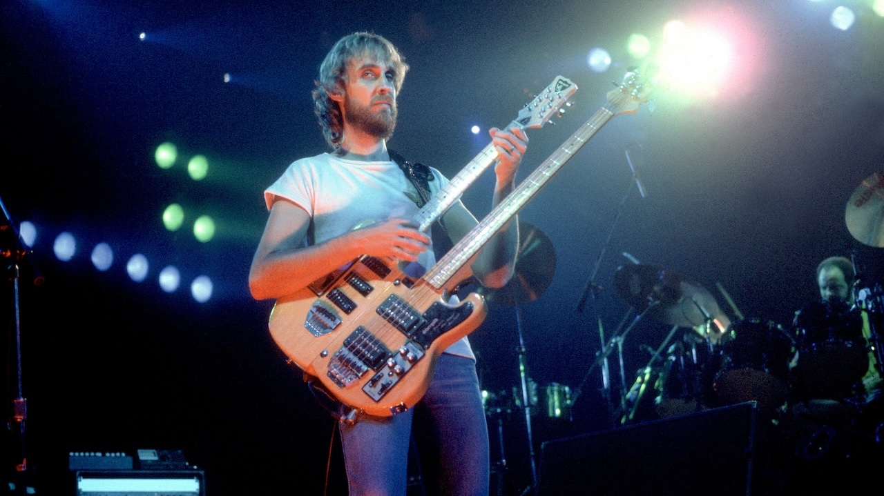 British Pop and Rock musician Mike Rutherford of the group Genesis performs onstage at the Poplar Creek Music Theater, Hoffman Estates, Illinois, October 2, 1982.