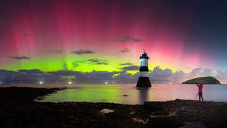 Red and green aurora above Penmon Lighthouse, Anglesey.