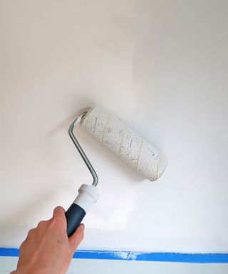 A wall being painted with a paint roller