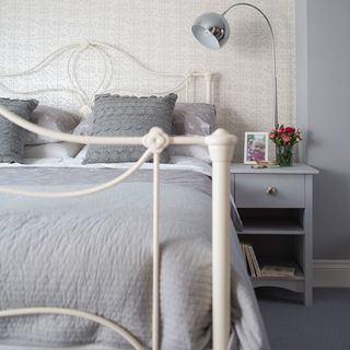 bedroom with beside grey vanity