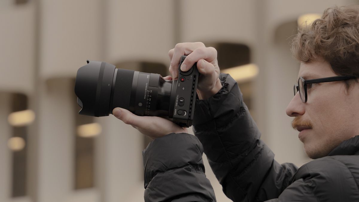 Sigma 50mm F1.2 DG DN Art lens in the hand