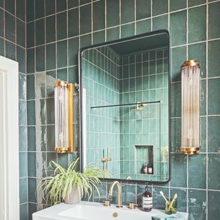 Tiled bathroom with a mirror and a sink