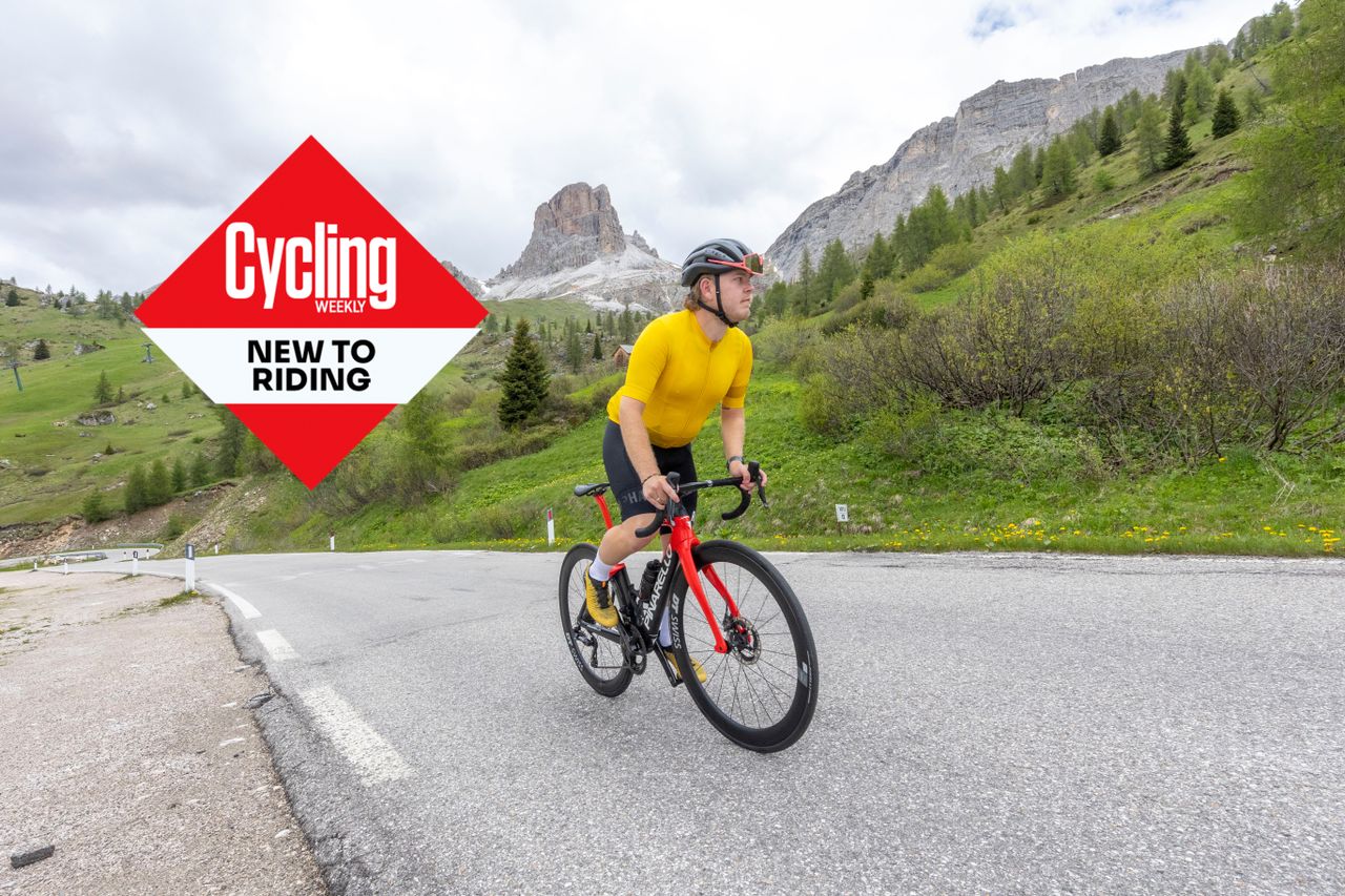 A cyclist in yellow in the Dolomites