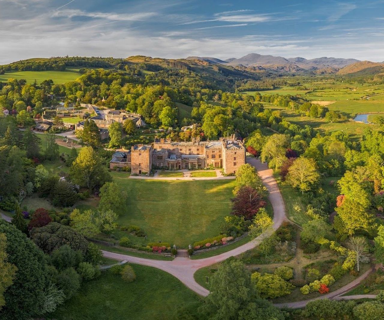 A castle seen from overhead showing a large garden and surrounding grounds