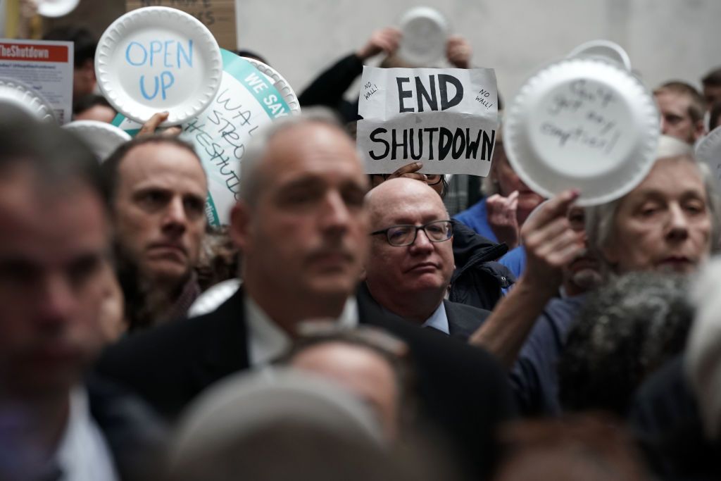 Government workers protest the shutdown.