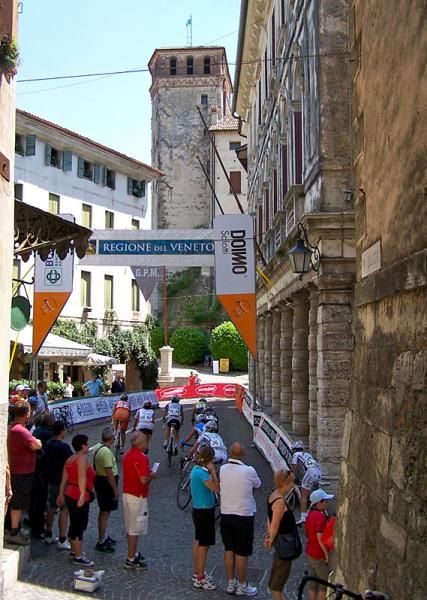 Riders pass town hall on their second lap.