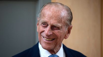 Prince Philip, Duke of Edinburgh, smiles after unveiling a plaque at the end of his visit to Richmond Adult Community College in Richmond on June 8, 2015 in London, England