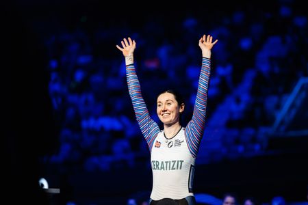 Katie Archibald with her arms aloft at the 2022 Track Champions League