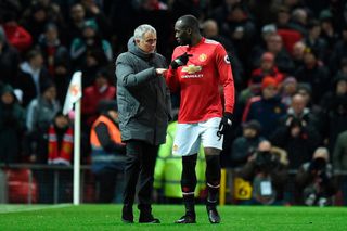 Manchester United's Portuguese manager Jose Mourinho (L) talks with Manchester United's Belgian striker Romelu Lukaku (R) during half-times during the English Premier League football match between Manchester United and Manchester City at Old Trafford in Manchester, north west England, on December 10, 2017. Chelsea