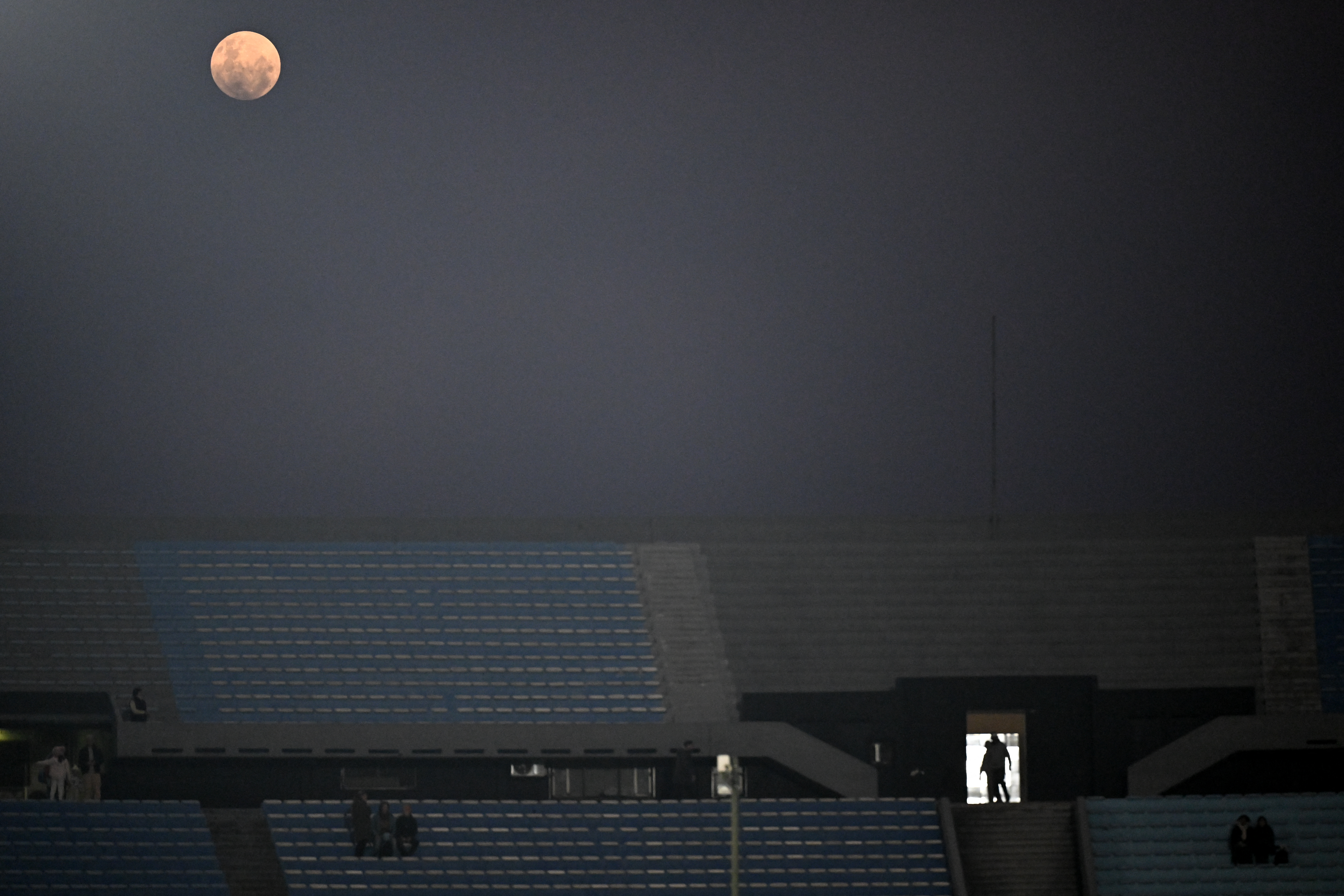 A photograph of the full Strawberry Moon over the Centenario stadium in Uruguay.
