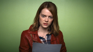 Emma Stone in red leather jacket with green screen behind her for an audition in La La Land 