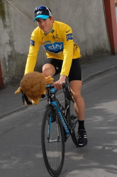 Ben Swift (Team Sky) takes a quick lap of honour with his new feline friend