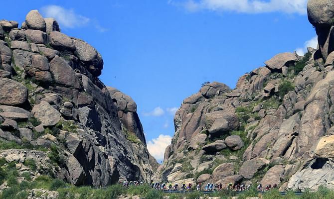 The Tour de San Luis peloton rolls along in stage 3's mountainous terrain.