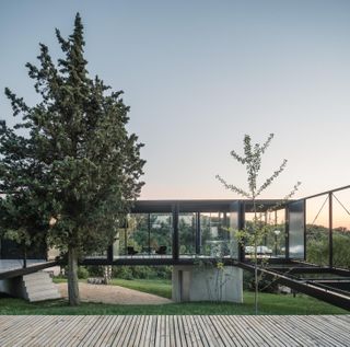 The house is raised up above the landscape and touches the ground at only three points