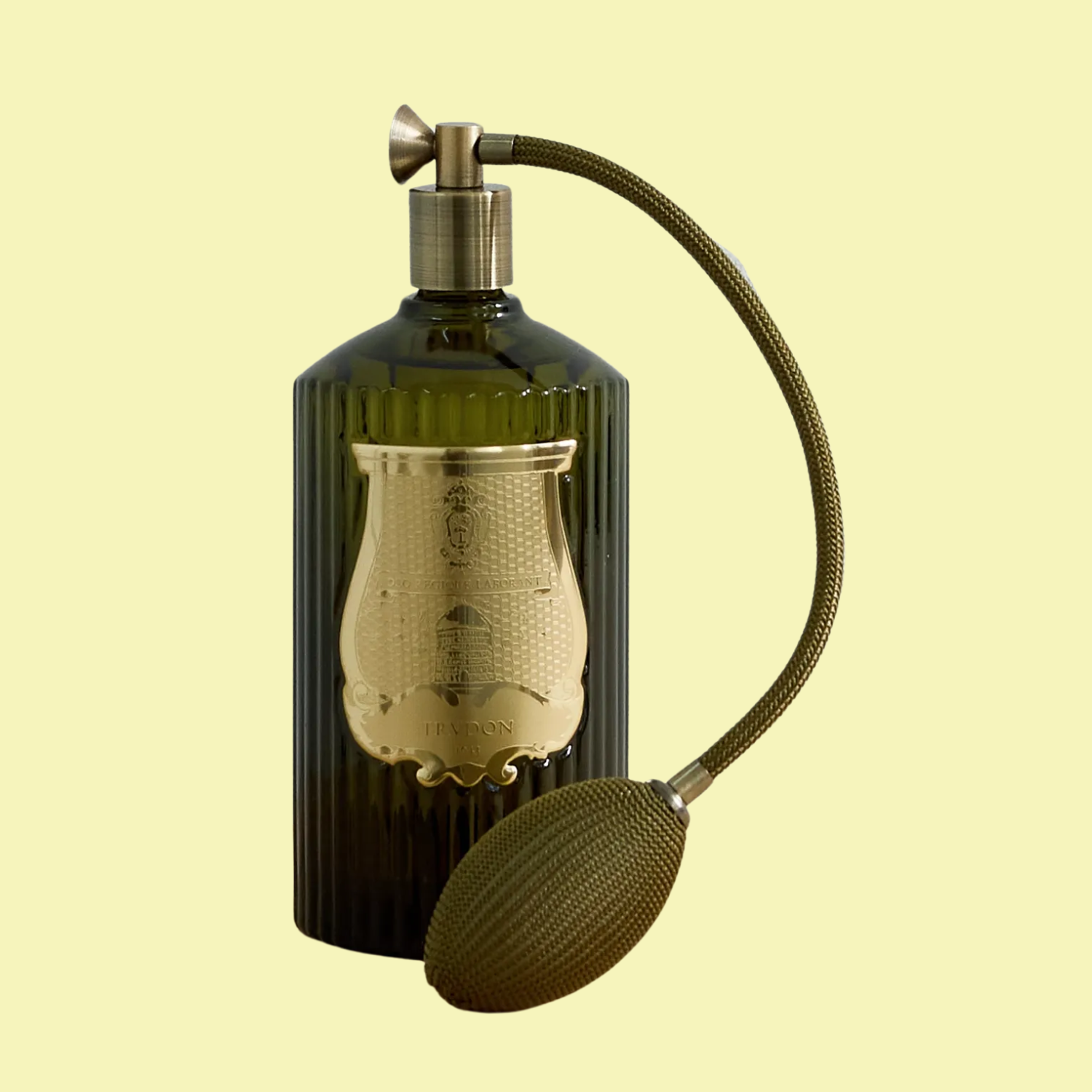 A green perfume bottle of room spray