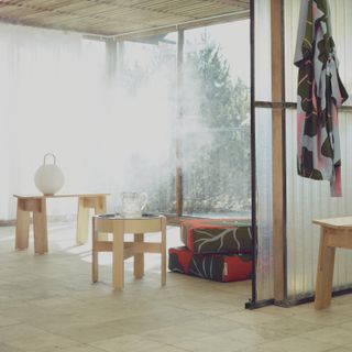 A spa-like space with wooden furniture and patterned textiles