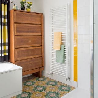 bathroom with towel rail and curtain