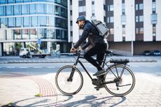 Image shows a person riding in some of the best bicycle commuter pants