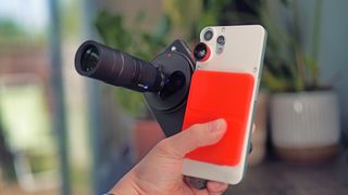 Vivo X200 Ultra phone next to a CMF Phone 2 Pro held in a hand