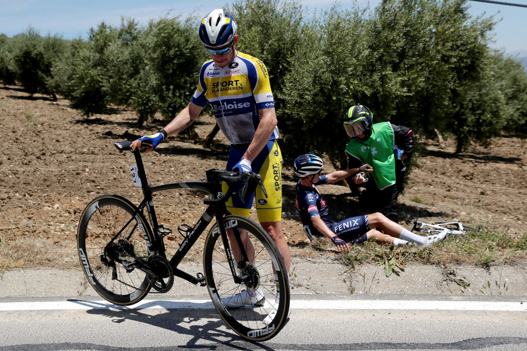 ALCALA LA REAL SPAIN MAY 19 Aaron Van Poucke of Belgium and Team Sport Vlaanderen Baloise Tobias Bayer of Austria and Team AlpecinFenix involved in a crash during the 67th Vuelta A Andalucia Ruta Del Sol 2021 Stage 2 a 183km stage from Iznajar to Alcal la Real 1028m VCANDALUCIA on May 19 2021 in Alcala la Real Spain Photo by Gonzalo Arroyo MorenoGetty Images
