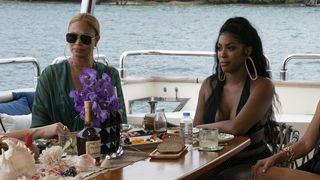 Gizelle and Porsha on a yacht in The Real Housewives Ultimate Girls Trip season 3