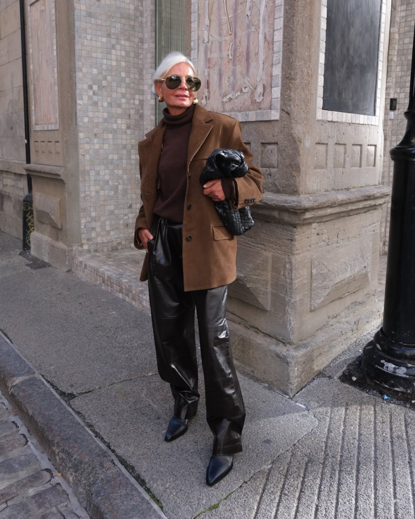 Woman wearing fall outfit with black ankle boots.