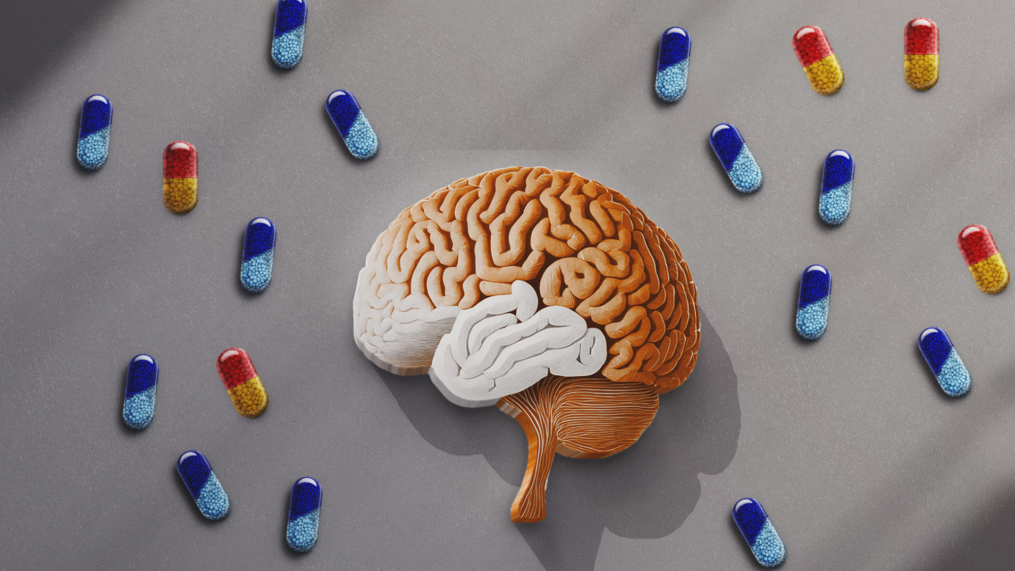 An illustration of a brown and white brain next to red and yellow and blue pills.